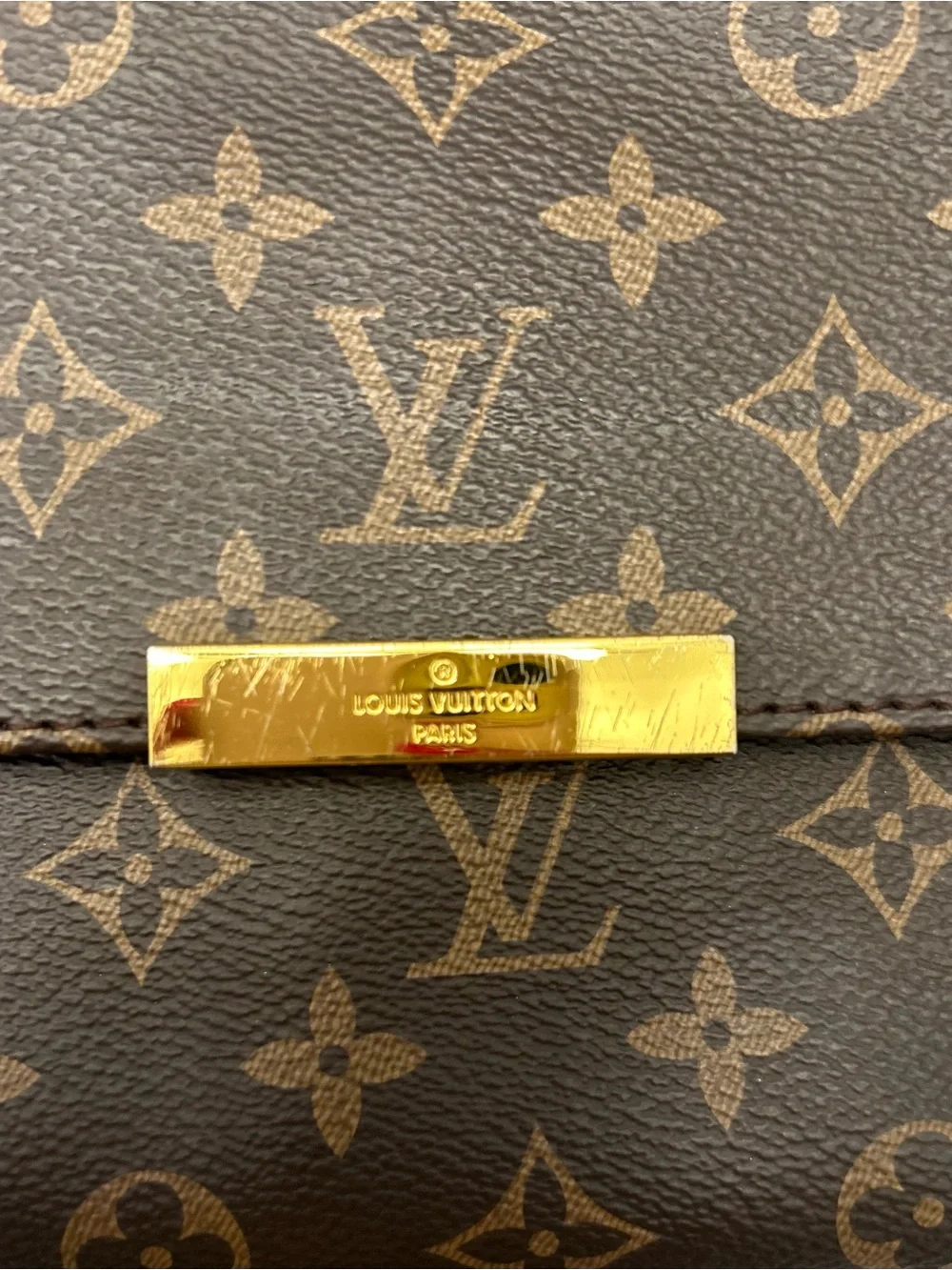 Louis Vuitton Monogram Canvas Clutch in Brown with Gold Accent